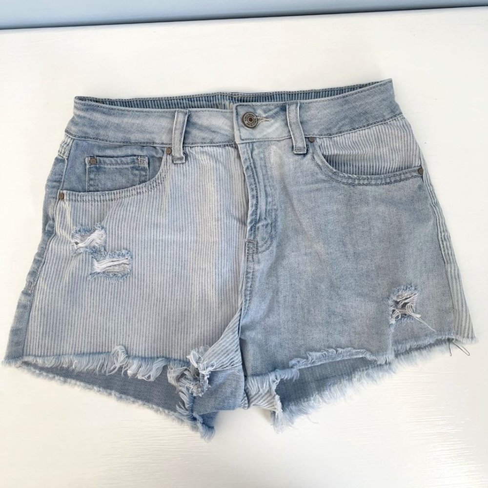 Mismatched pattern faded blue ripped jean shorts